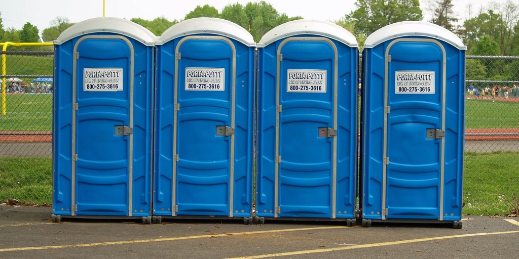 porta potties in various outdoor settings