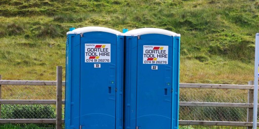 portable toilet in outdoor festival setting