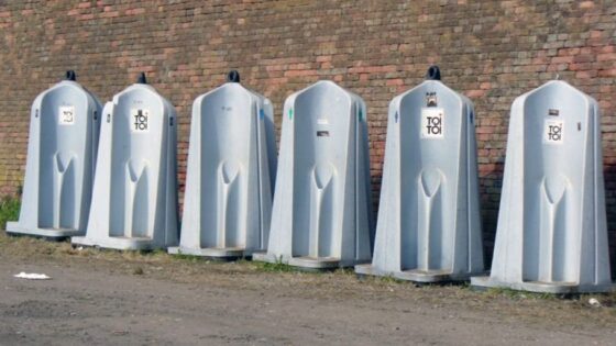 clean construction site with portable toilets and handwashing stations