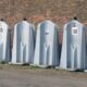 clean construction site with portable toilets and handwashing stations