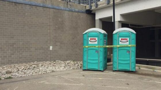 cleaning porta potty in outdoor event