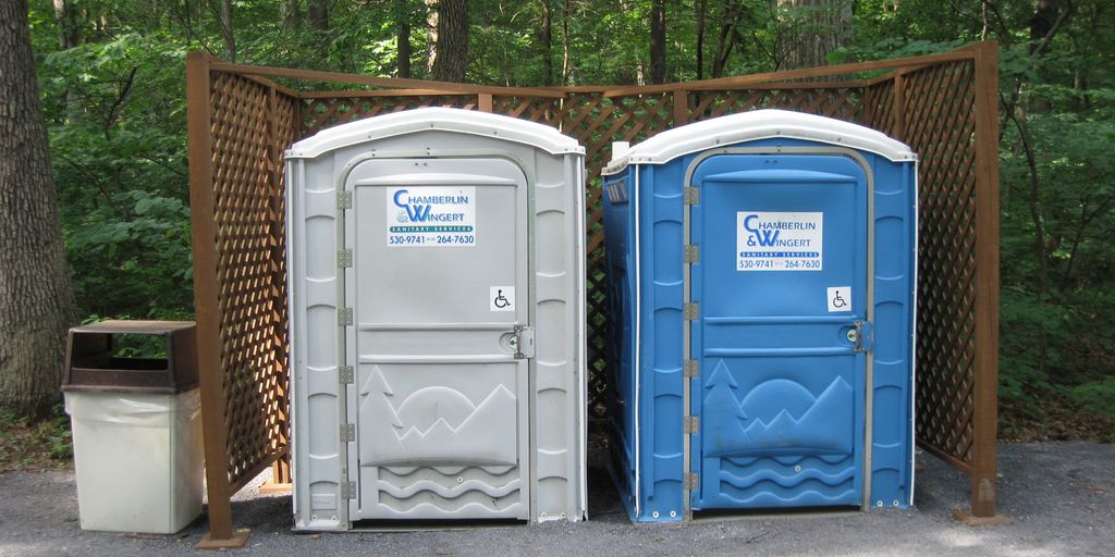 variety of porta potties at an outdoor event