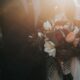 groom beside bride holding bouquet flowers