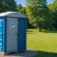 Clean porta potty in a scenic outdoor setting