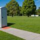 Portable toilet with waste disposal unit